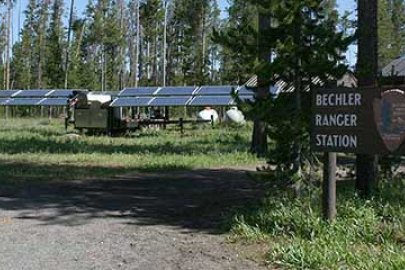 Solar panels set up in the woods of Yellowstone National Park.